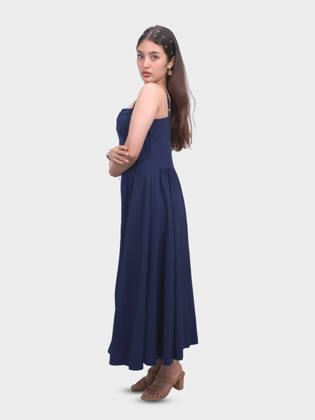 Woman wearing a navy blue strapless dress