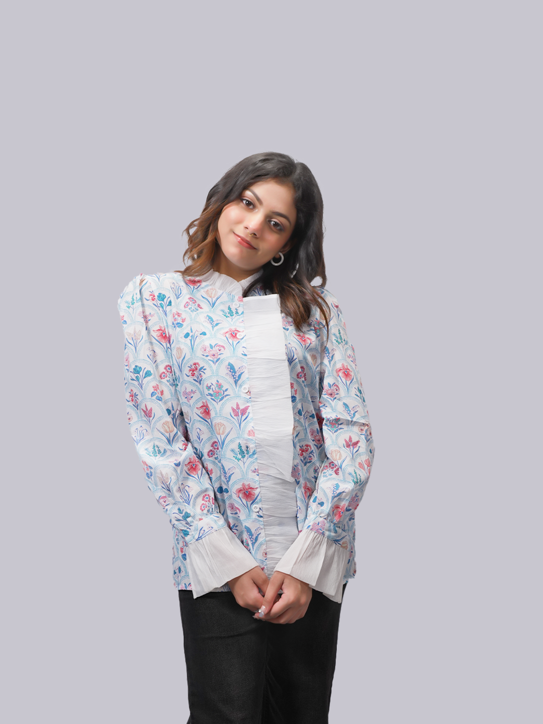 A woman modeling a light blue floral jacket with a white pleated .