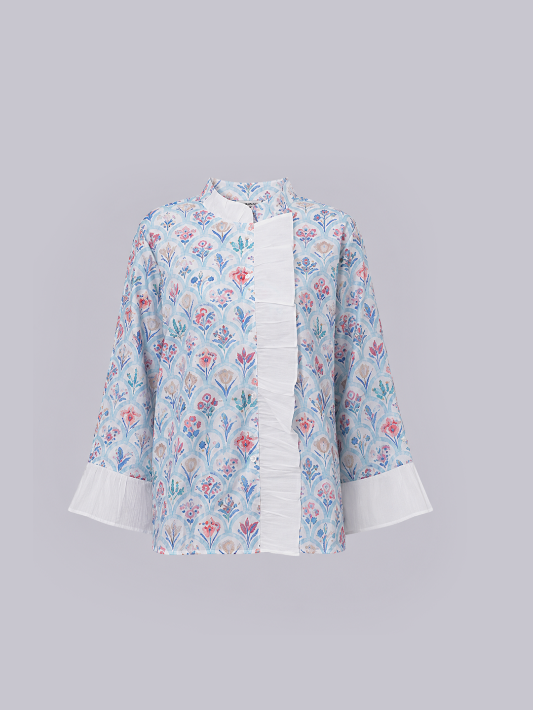 A light blue long-sleeve blouse with a multicolor floral print.