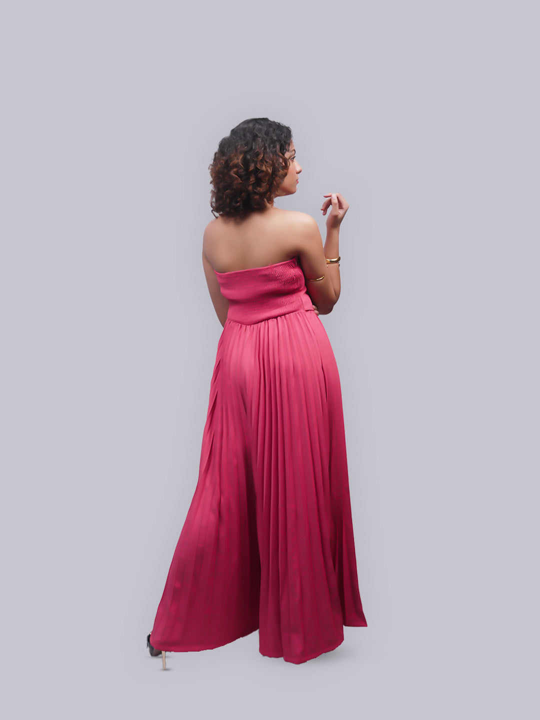 A strapless magenta maxi dress