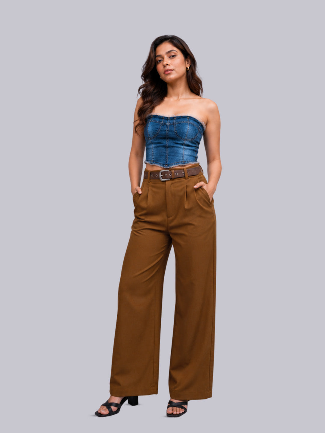 A high-waisted, wide-leg brown trousers