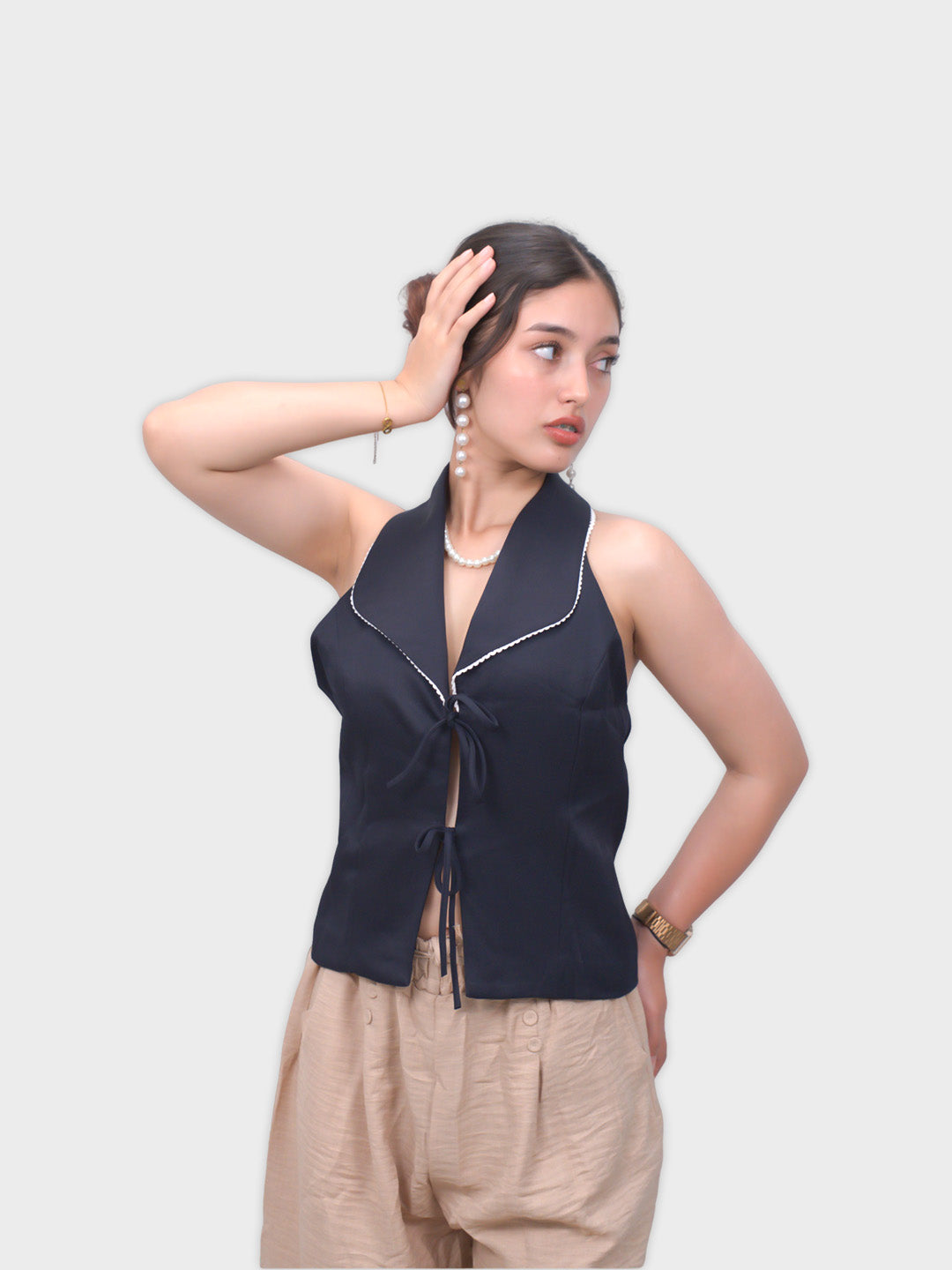 Woman wearing a black sleeveless top