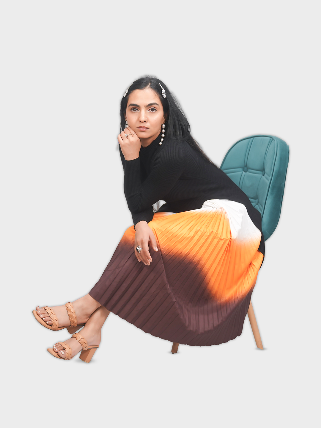 Woman sitting on a chair wearing a black top
