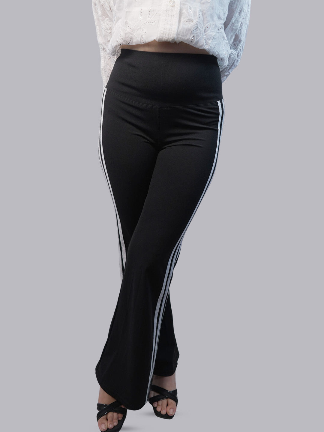 A model wearing a white lace top