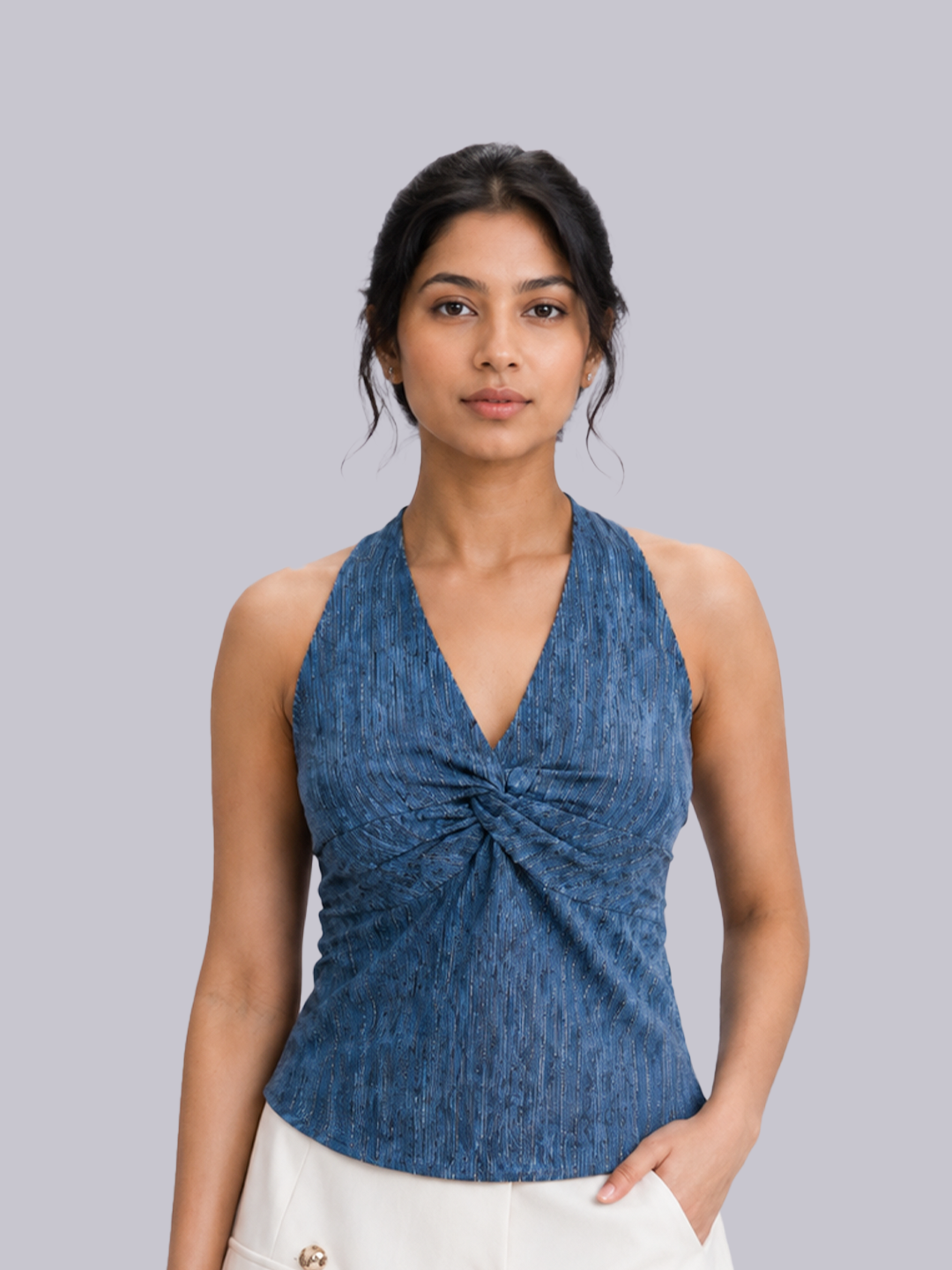 A woman modeling a sleeveless blue textured halter top.