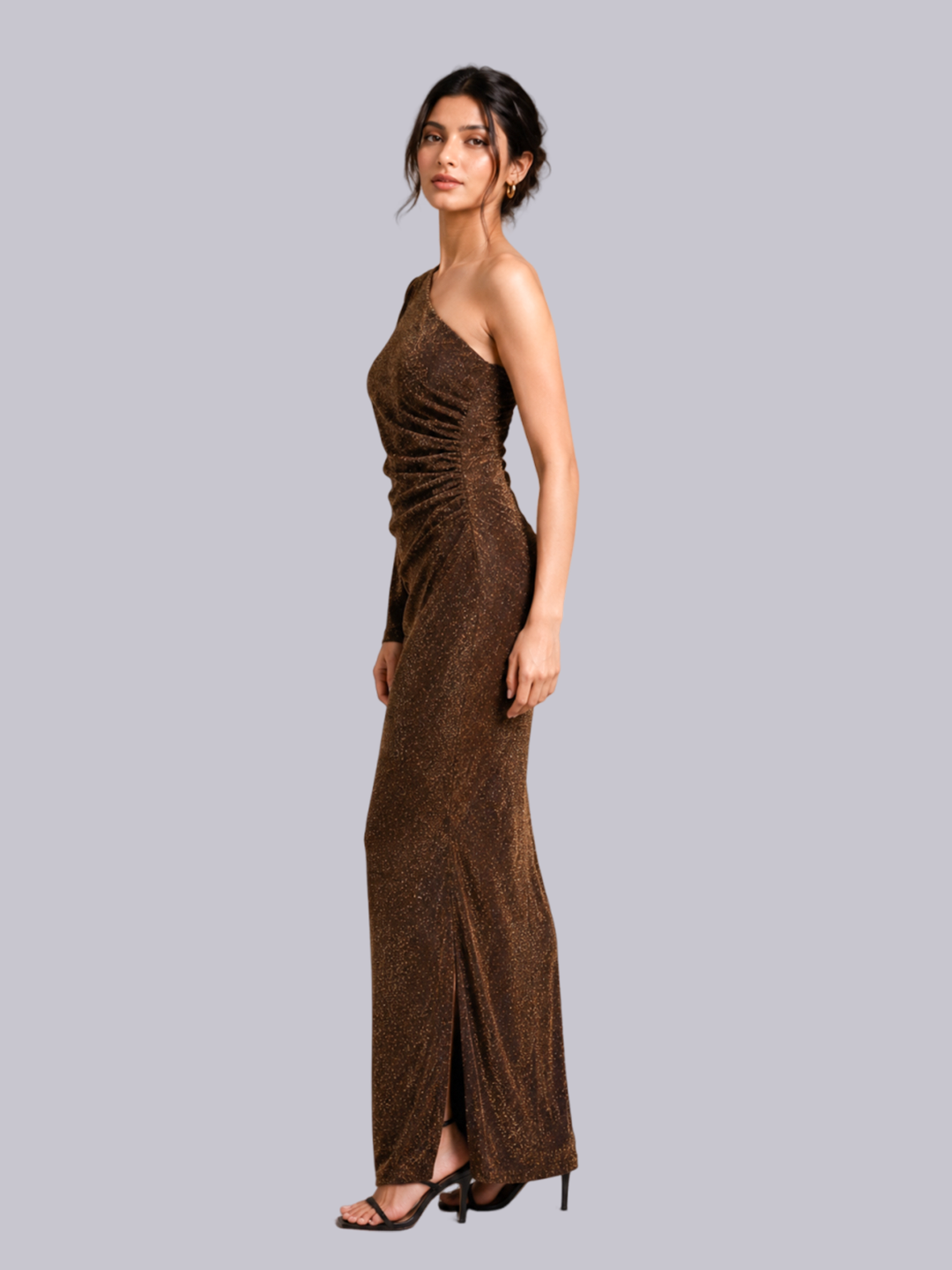 A woman modeling a floor-length, one-shoulder.