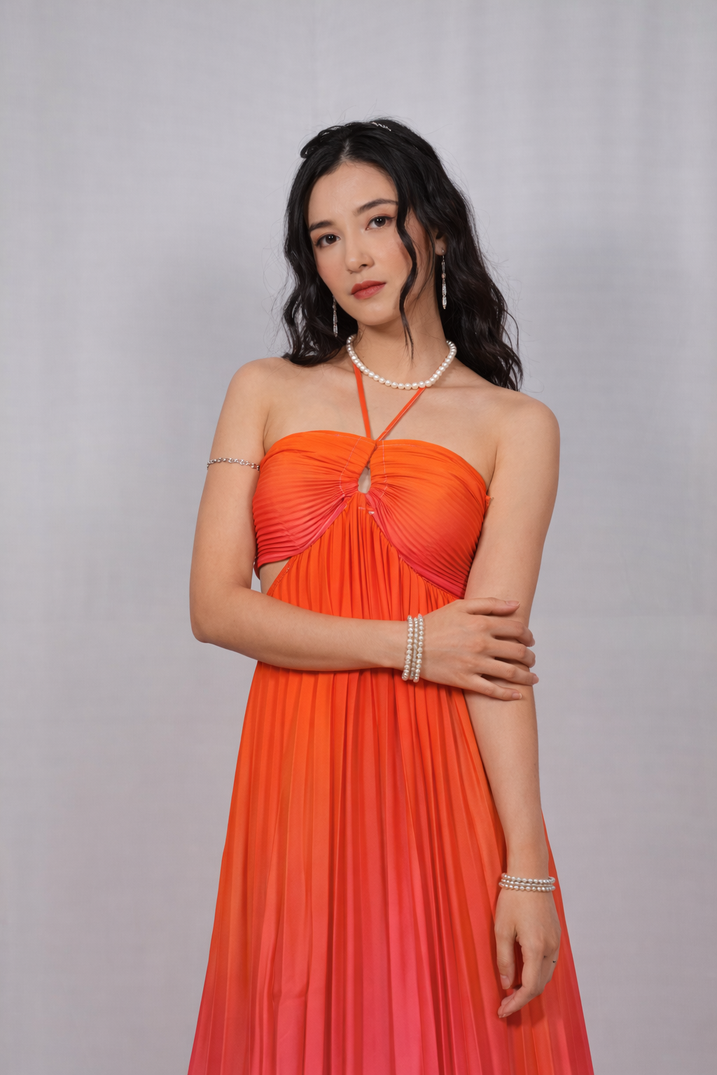 Woman wearing an orange strapless dress