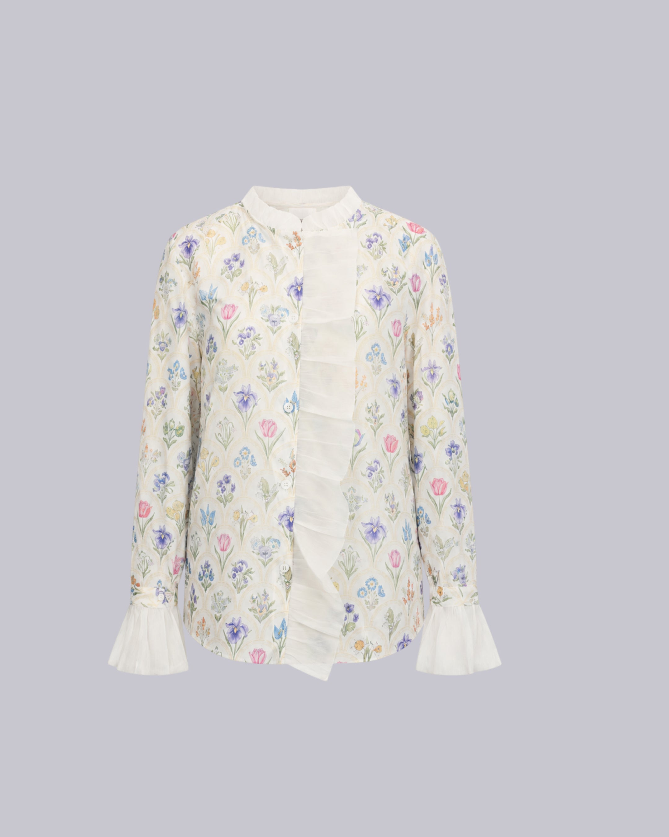 A long-sleeve blouse with a rainbow design.
