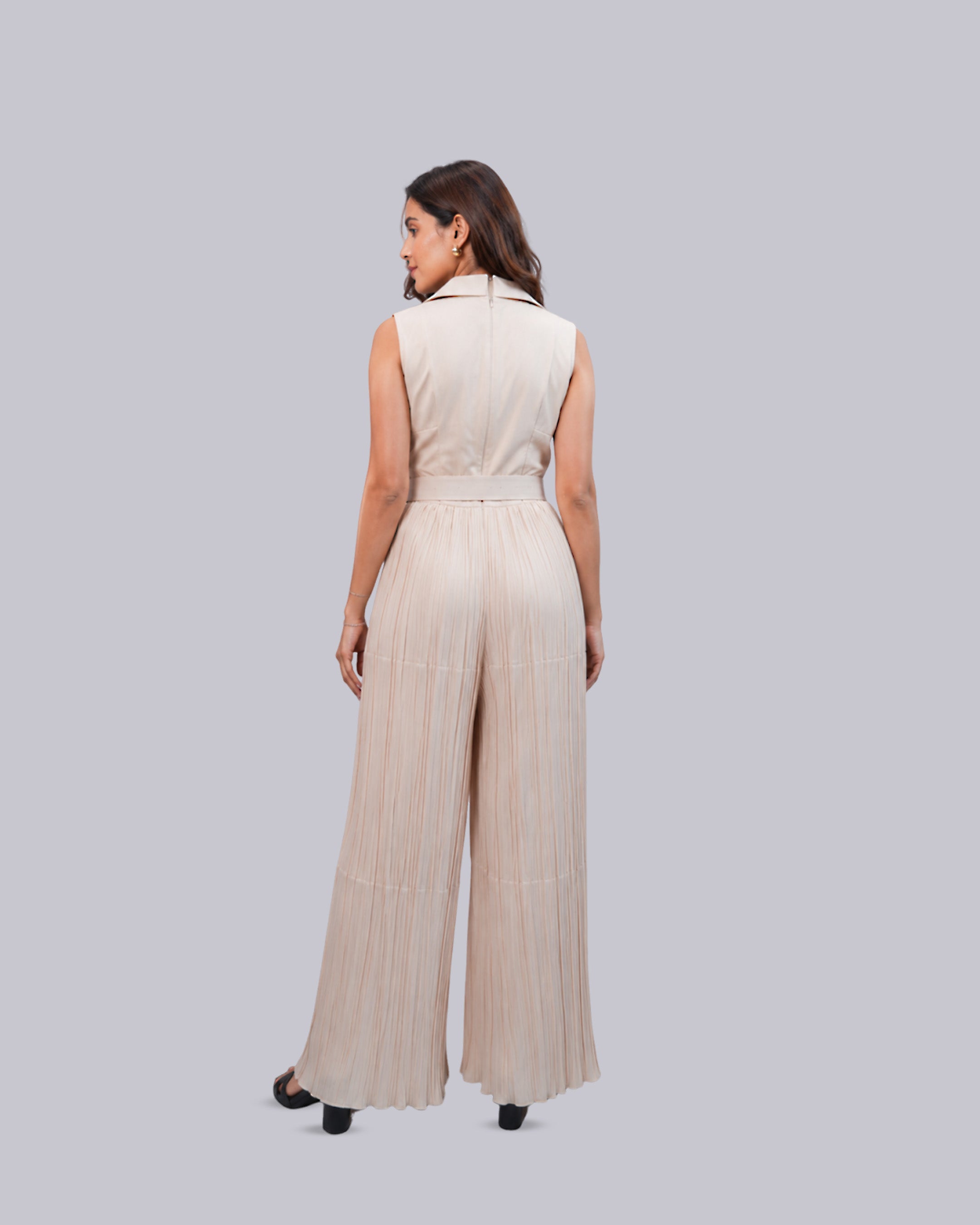 high-waisted jumpsuit in a light beige or cream color