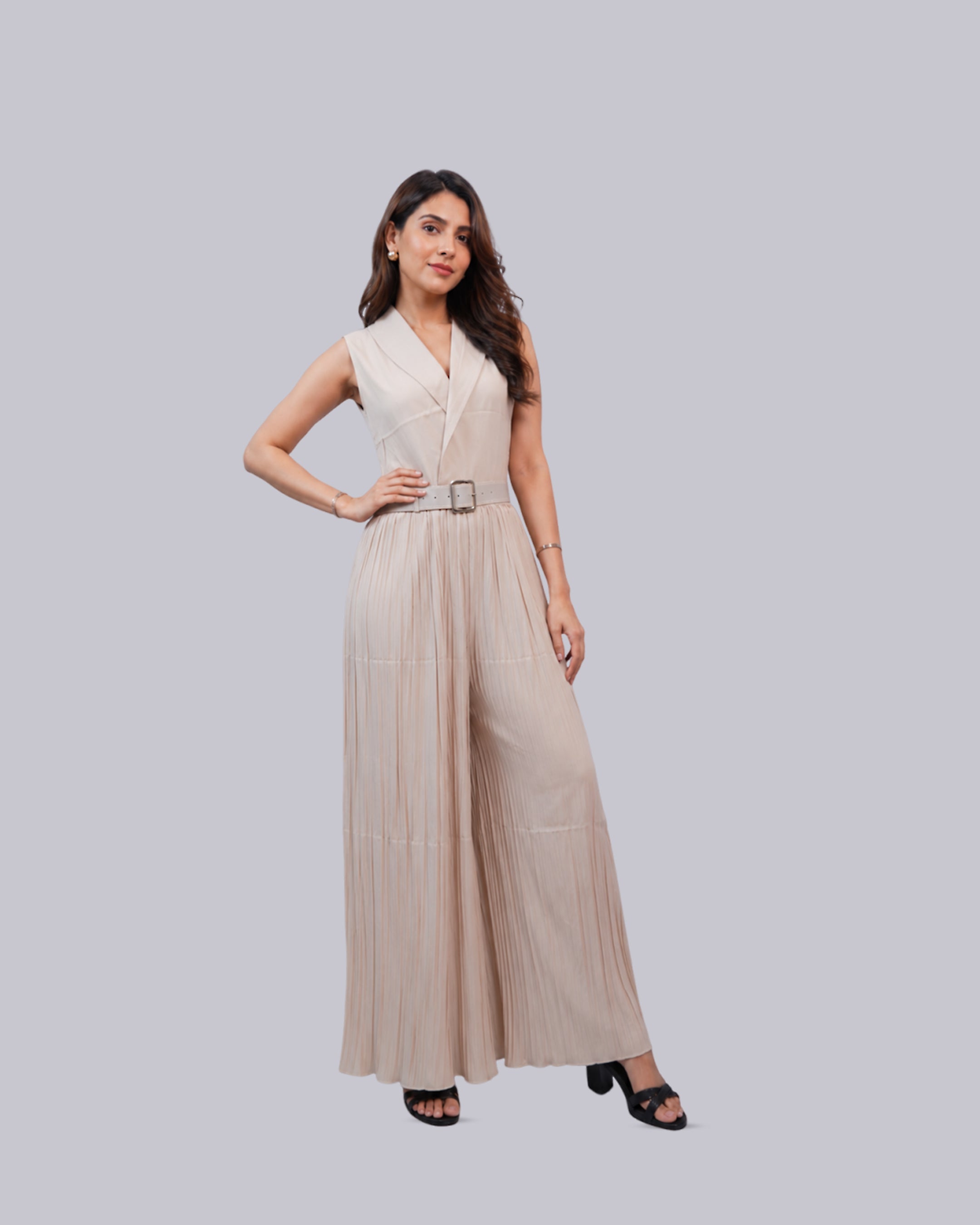 A sleeveless beige maxi jumpsuit with a wrap-style V-neckline.
