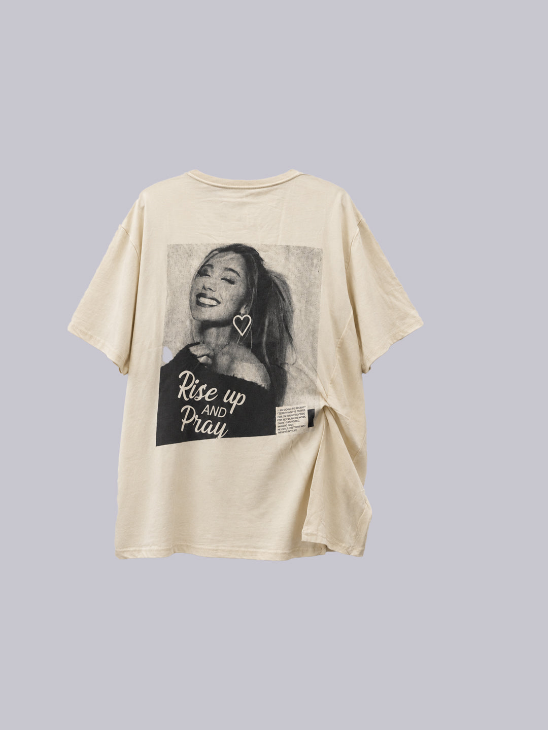A cream-colored short-sleeve graphic t-shirt featuring a black-and-white photo.