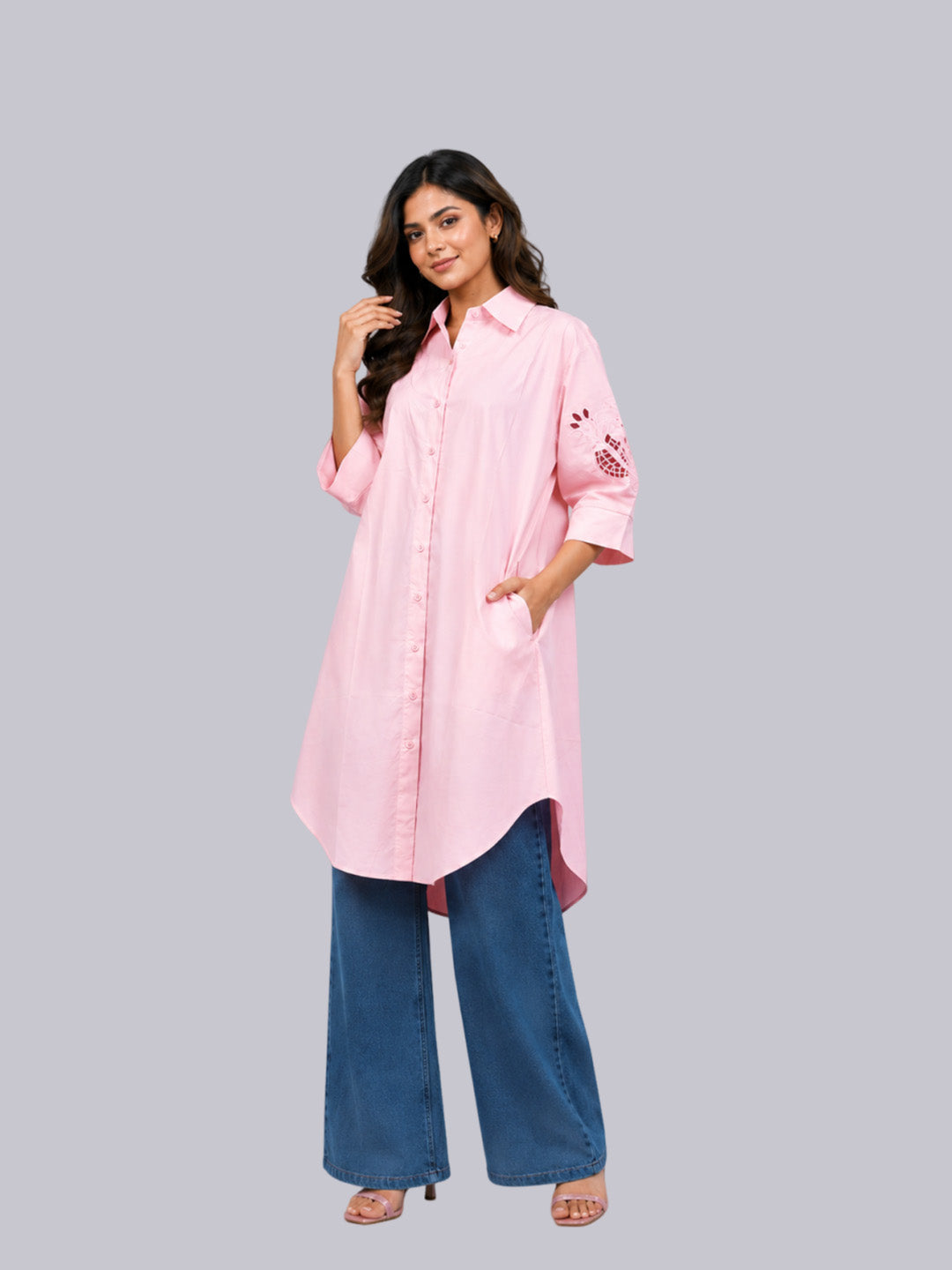 A light pink long-sleeve button-up shirt tunic.