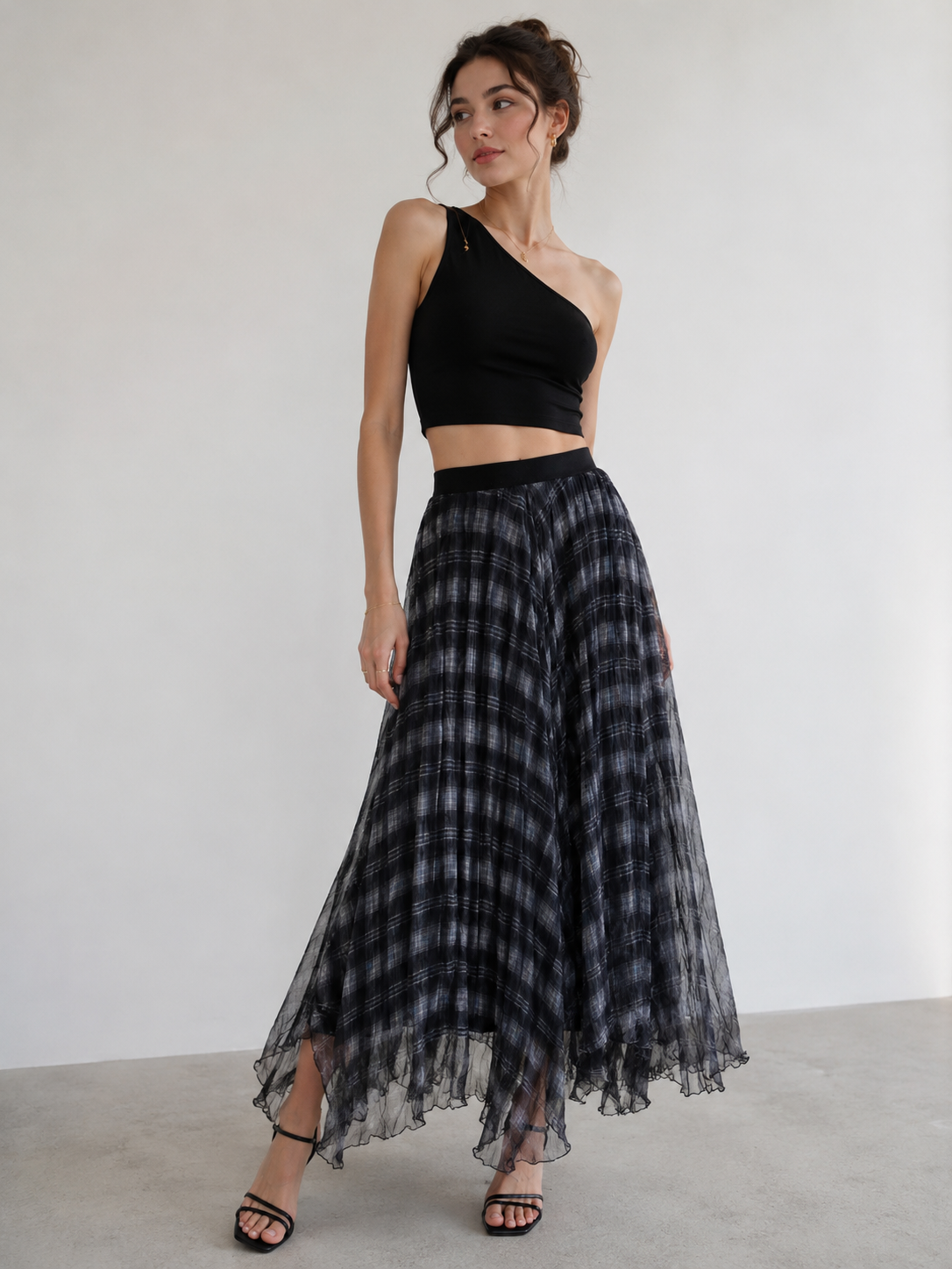 A black one-shoulder crop top