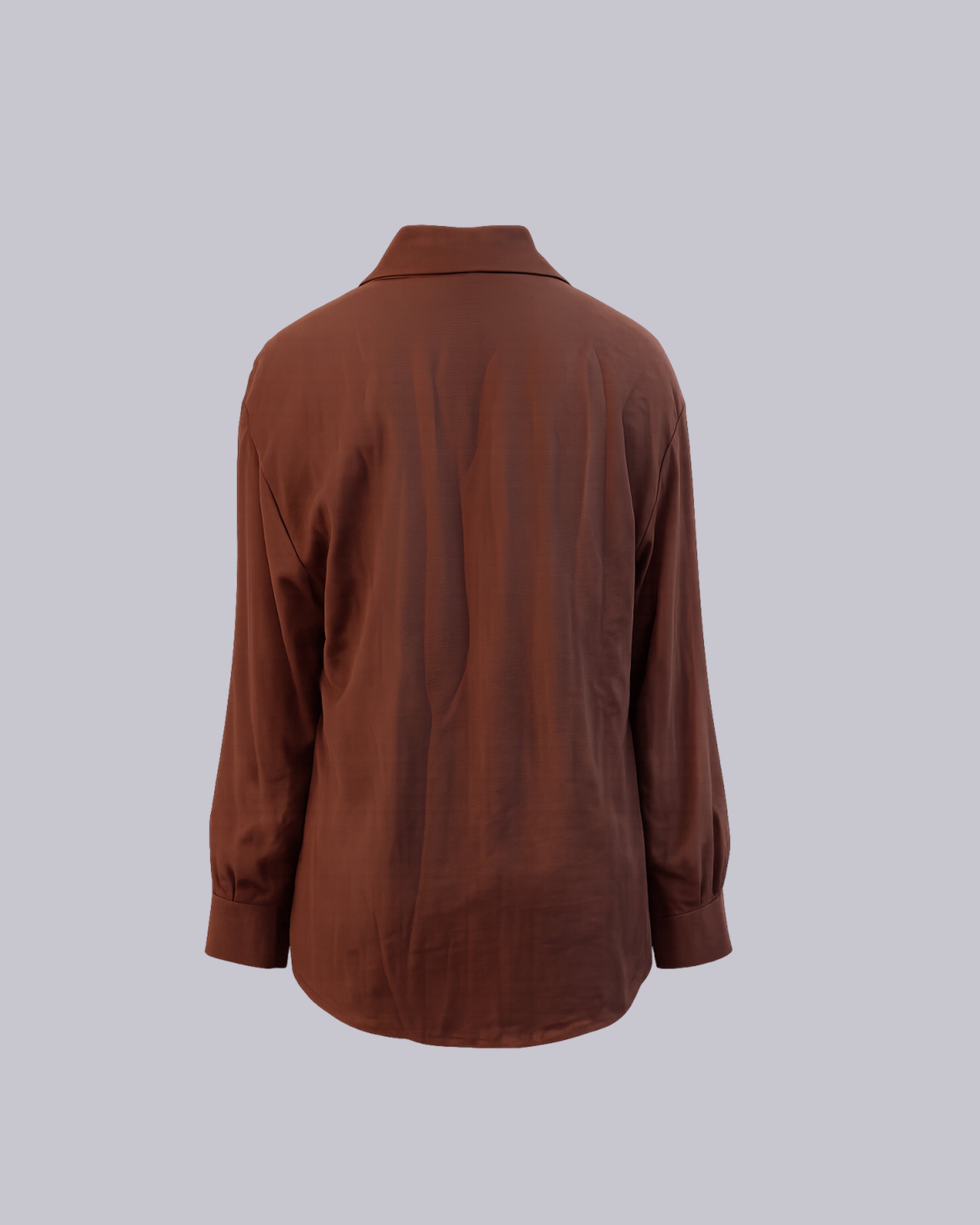 A brown long-sleeve button-up shirt .