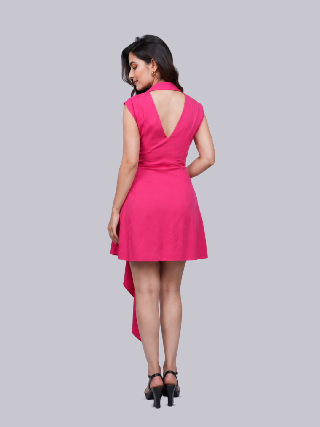 A bright pink sleeveless wrap-style dress