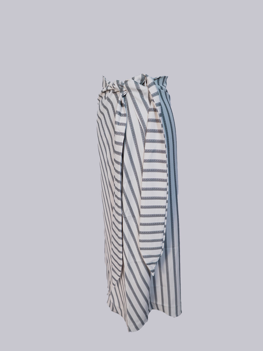 A high-waisted, midi-length wrap skirt featuring a vertical black and white stripe pattern.