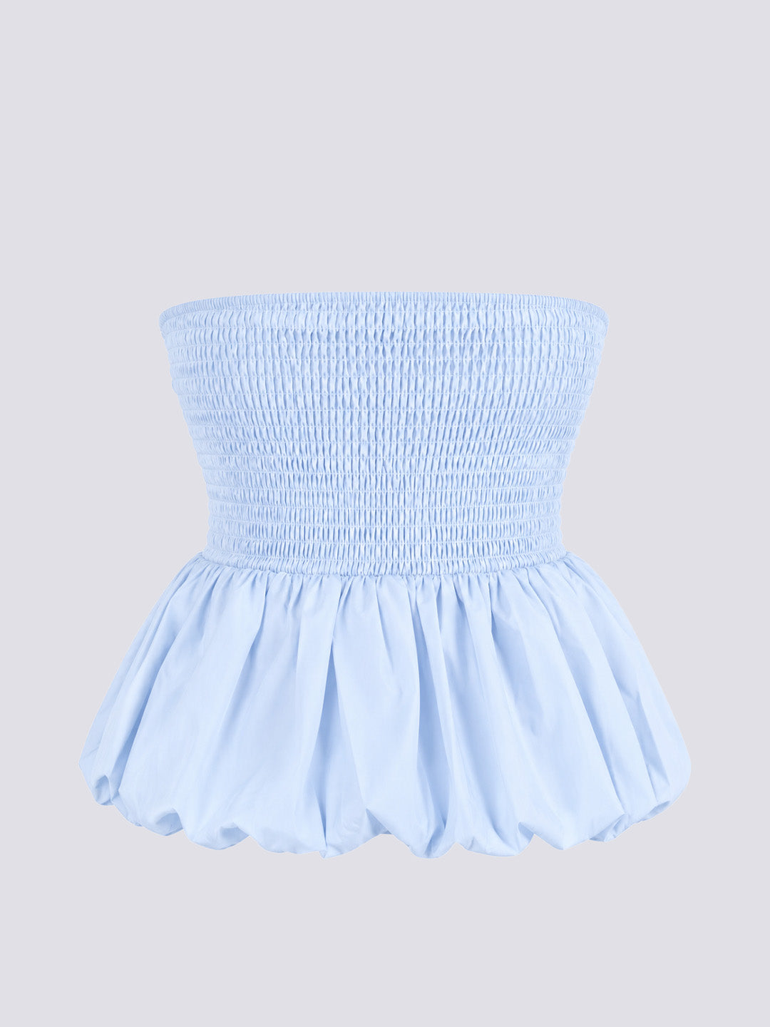 A light blue strapless smocked top with a gathered peplum skirt.