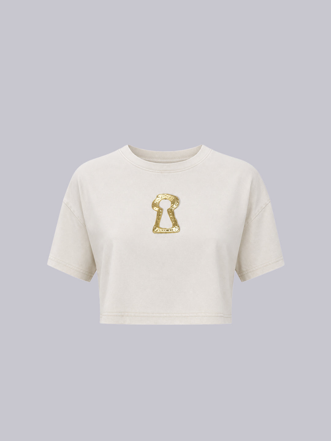 An off-white cropped short-sleeve t-shirt.