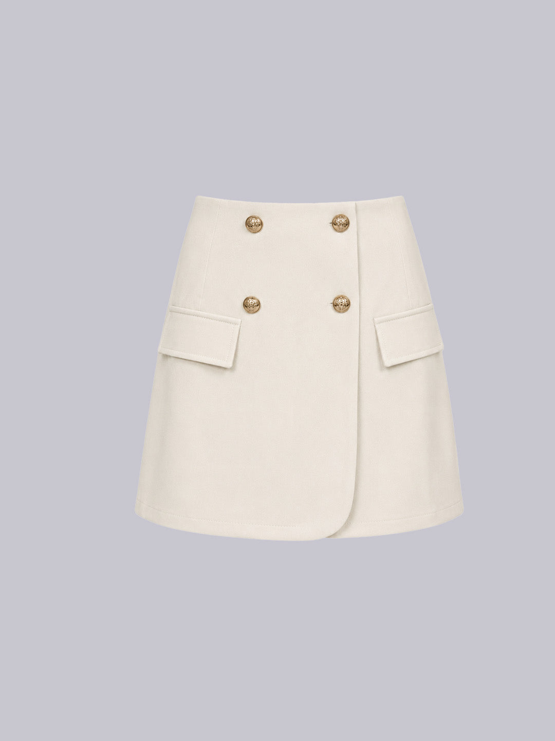 An off-white A-line mini skirt with a double-breasted design, featuring four gold-tone buttons and two flap pockets on the sides.