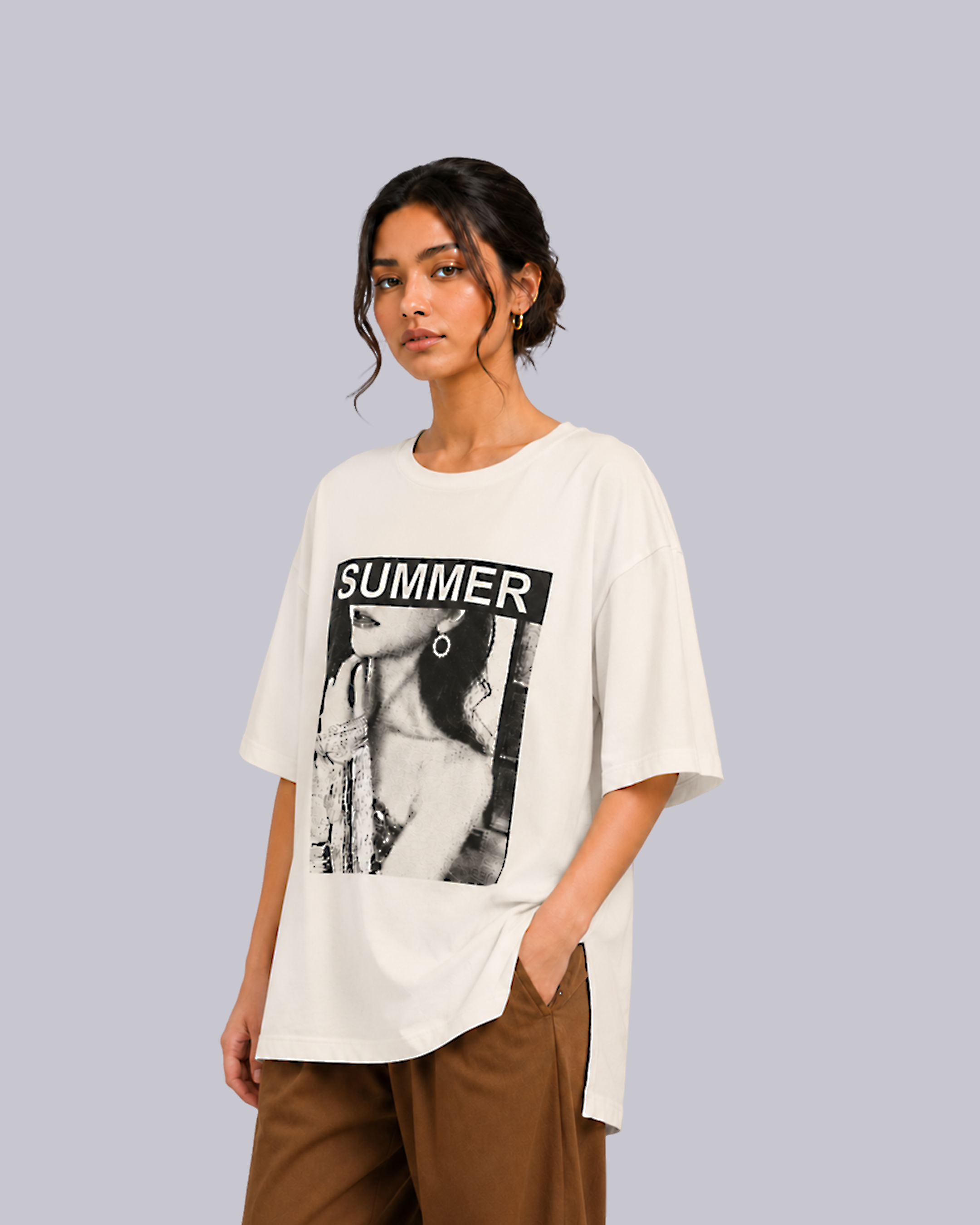 A woman modeling an oversized off-white graphic t-shirt.