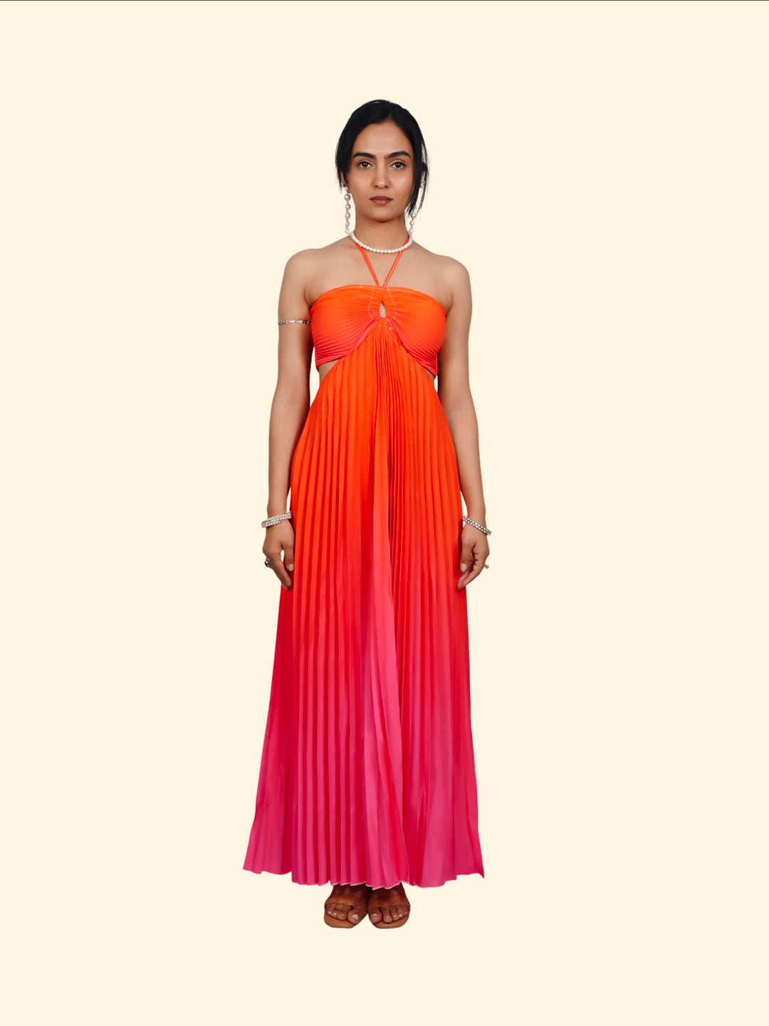 Woman wearing a gradient dress with orange to pink color