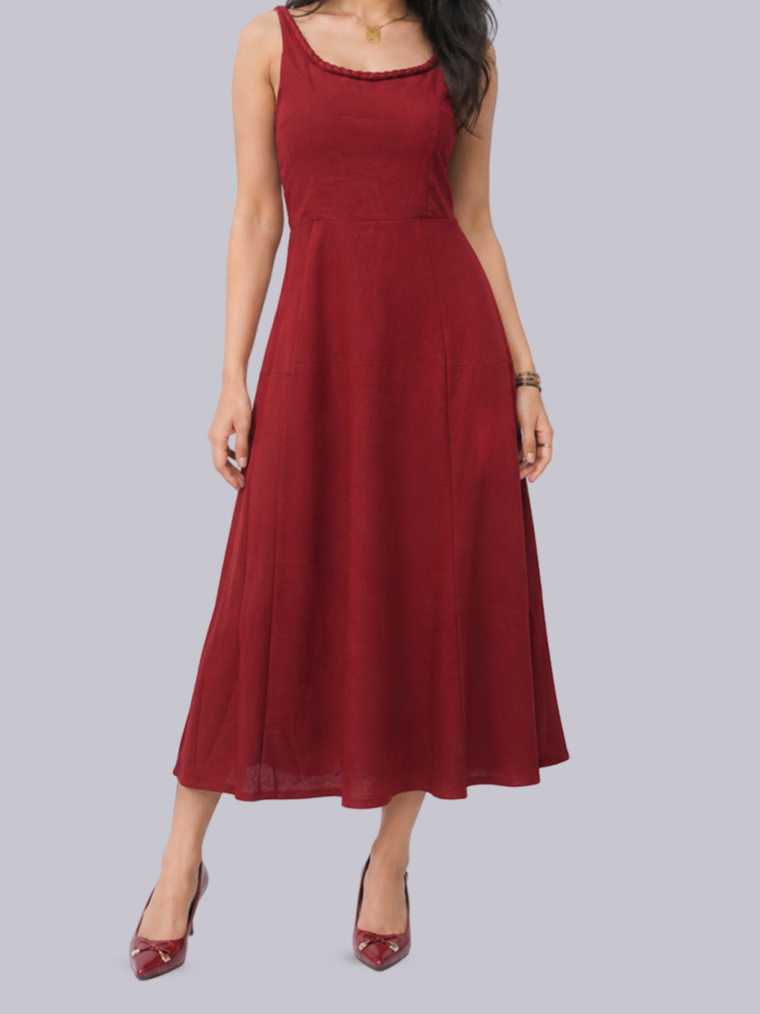 A sleeveless, scoop-neck midi dress.