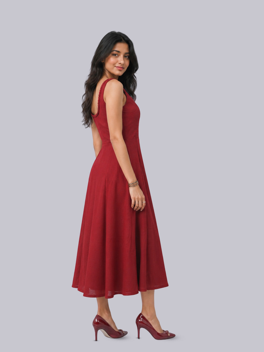 A sleeveless, red midi dress.