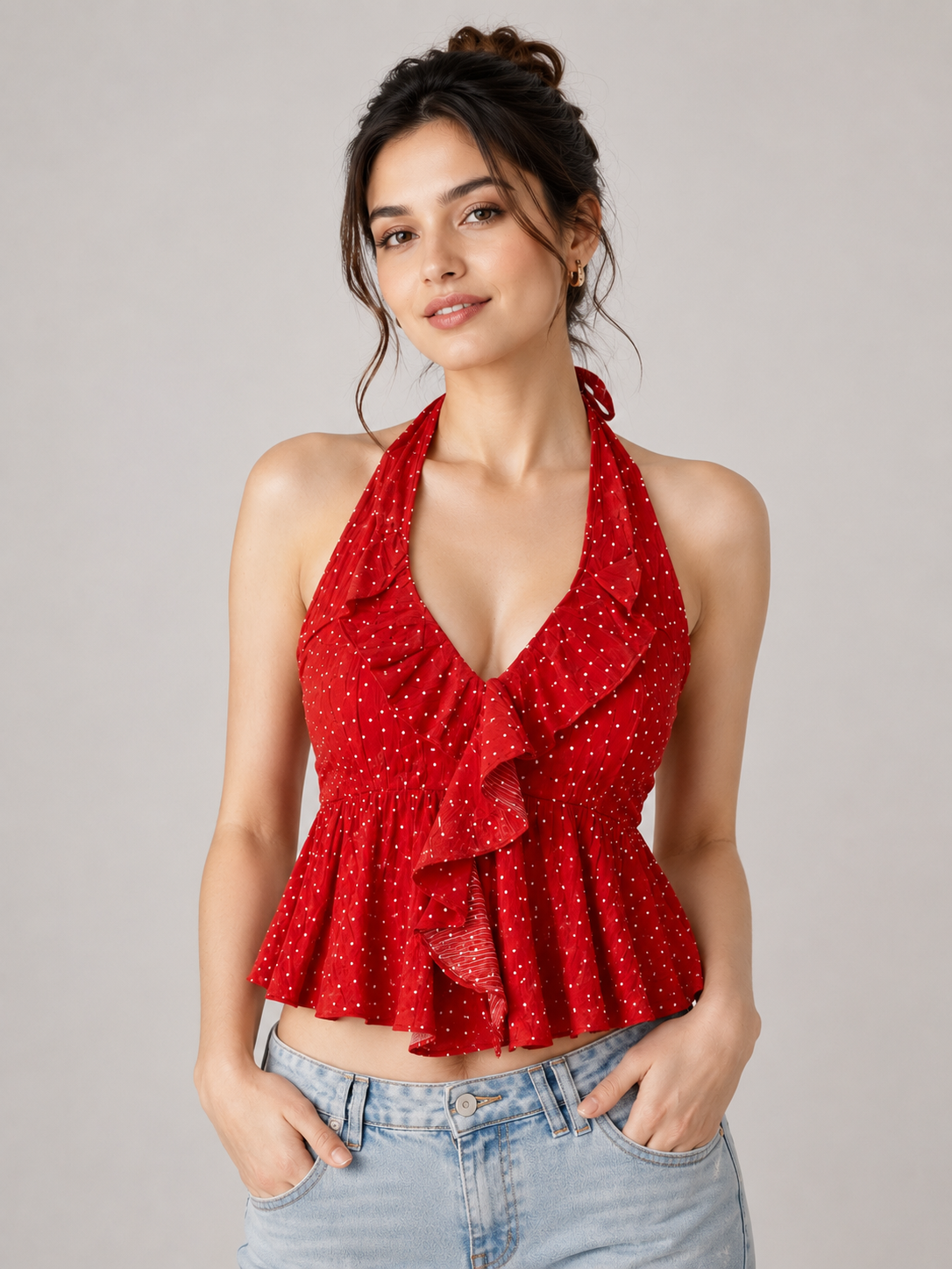 Ared halter crop top with a white polka dot pattern