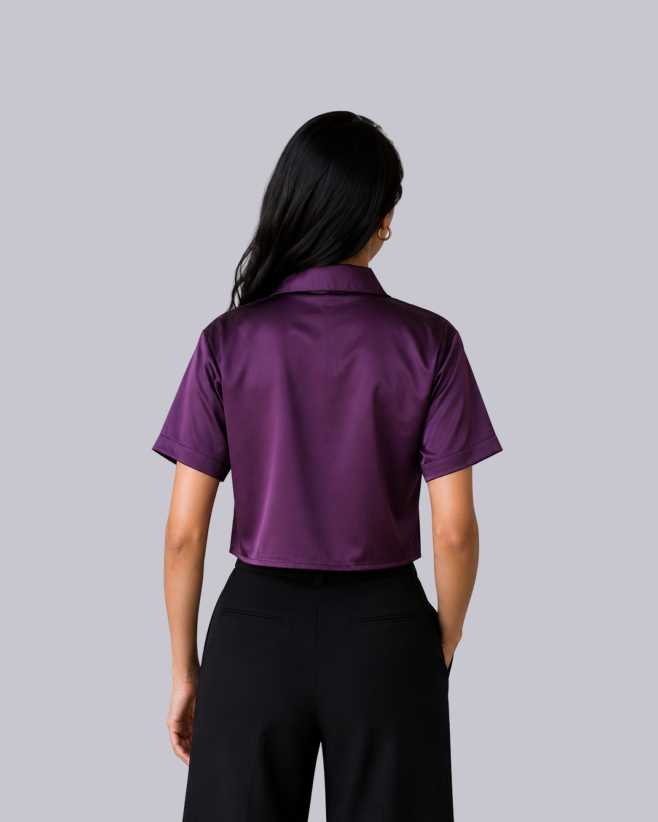 A short-sleeve collared purple satin-like blouse