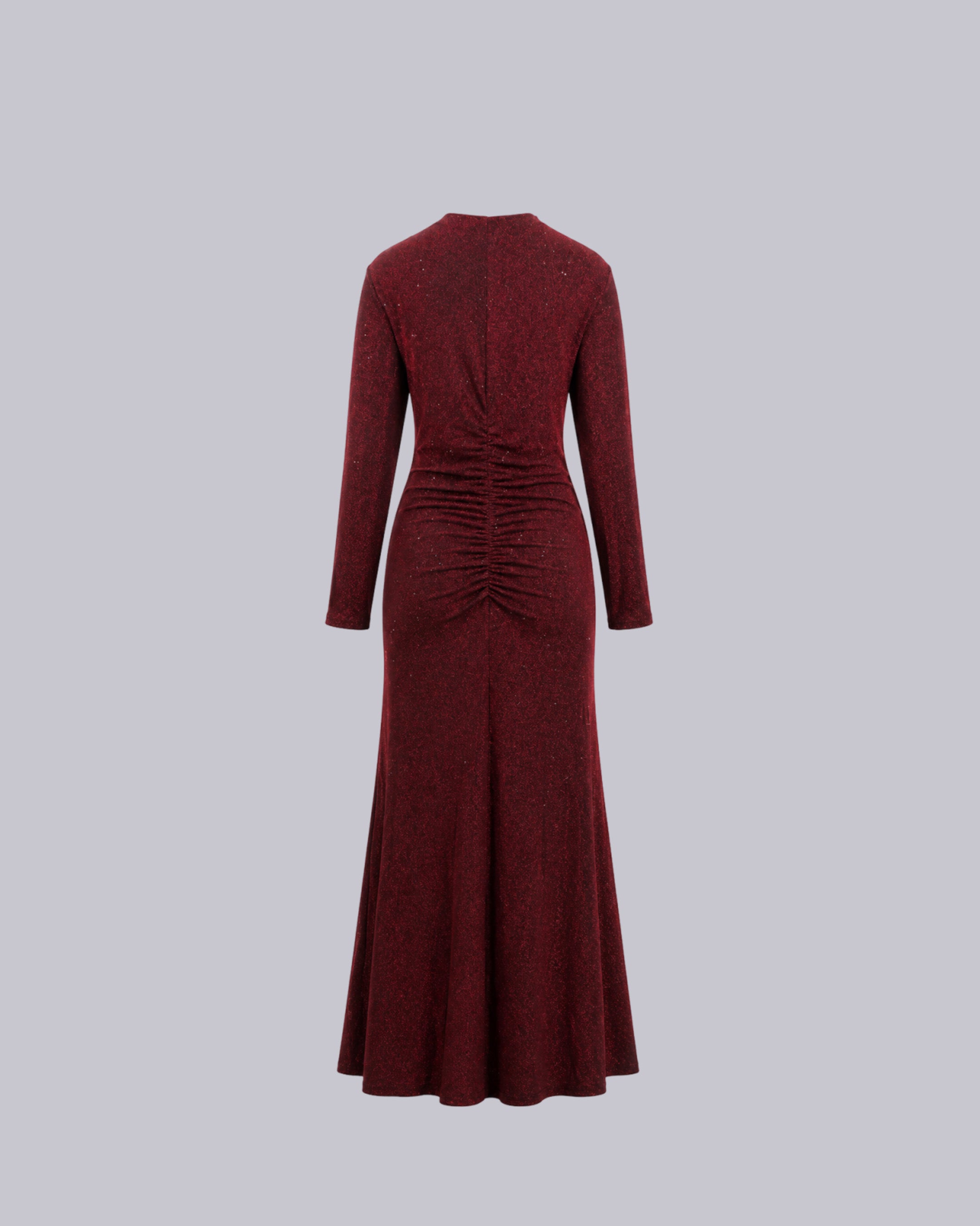 A long-sleeved, floor-length burgundy dress