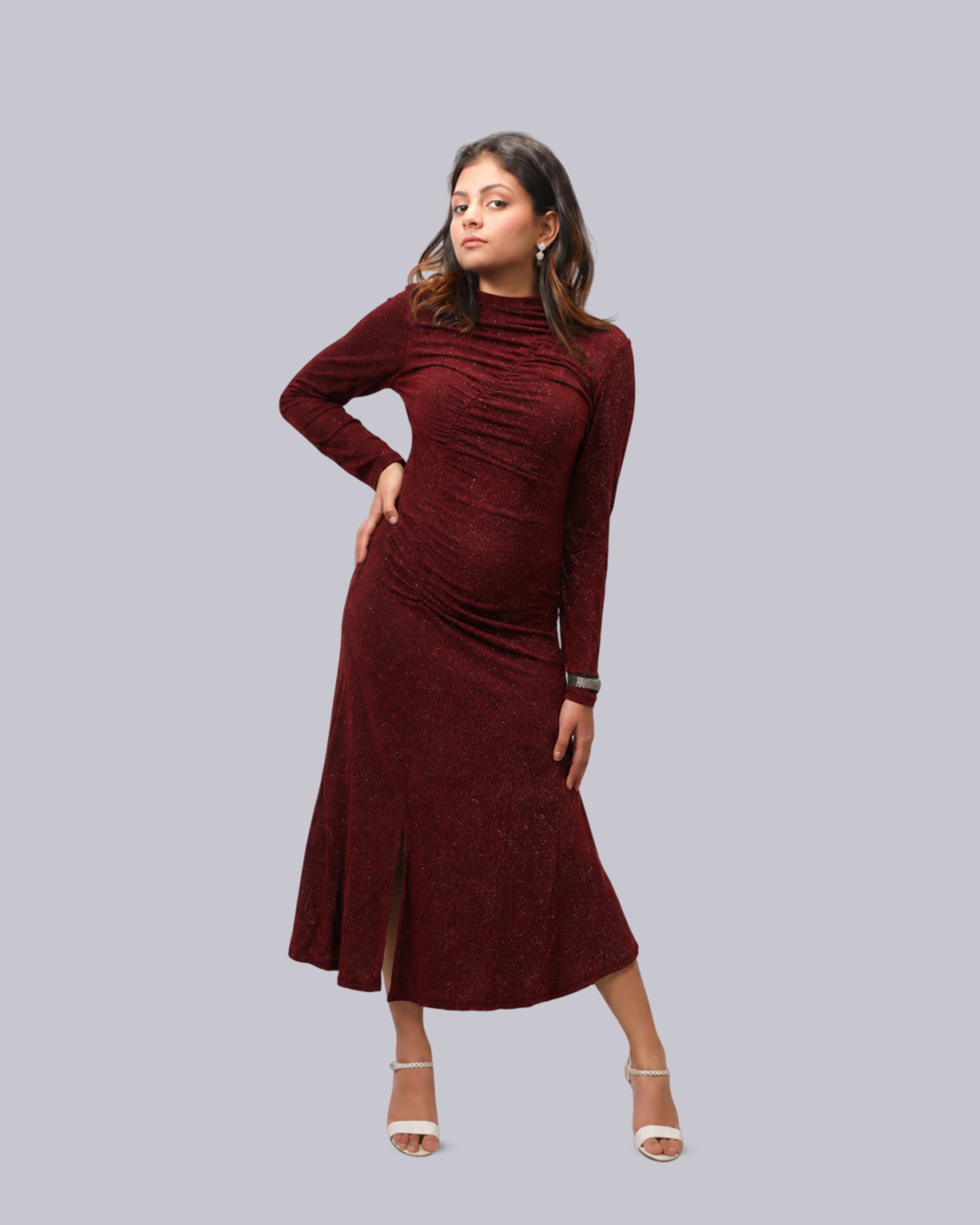 A long-sleeve, high-neck, ruched midi dress