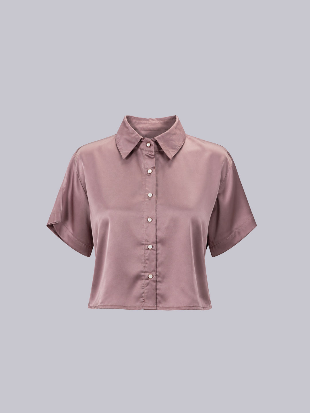 A short-sleeve button-up shirt in a dusty mauve or muted rose color, displayed .