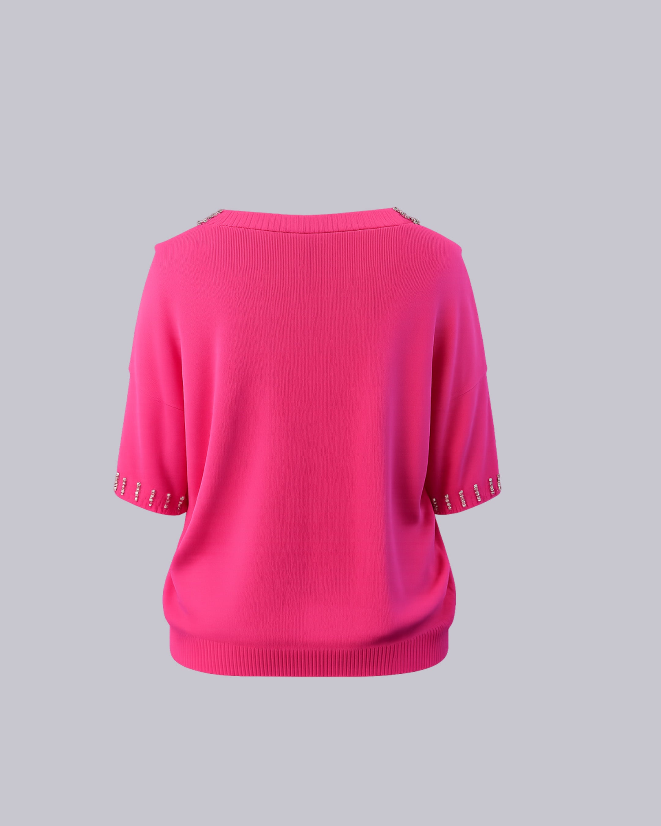 A bright pink knit sweater.