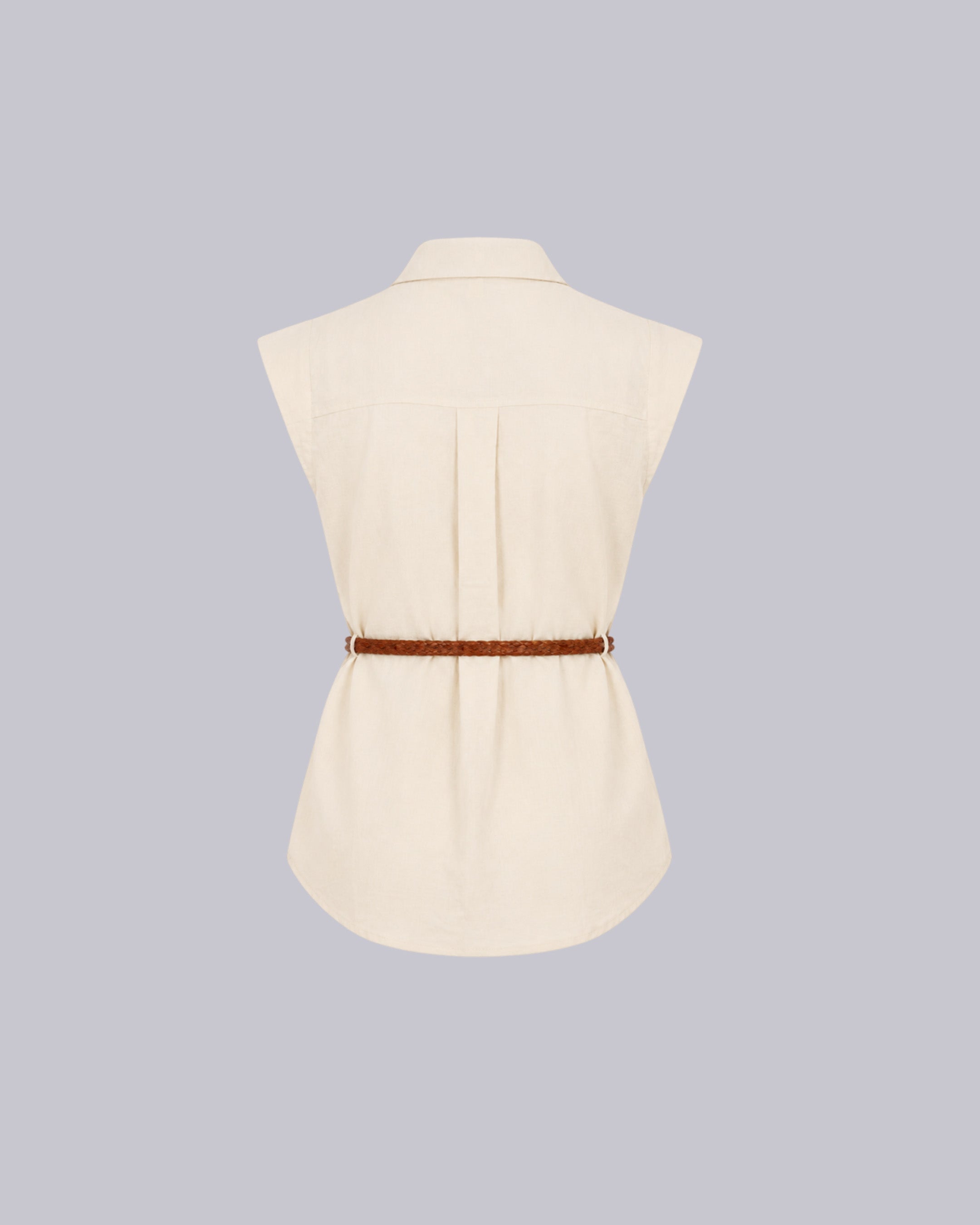 A Sleeveless cream color dress.