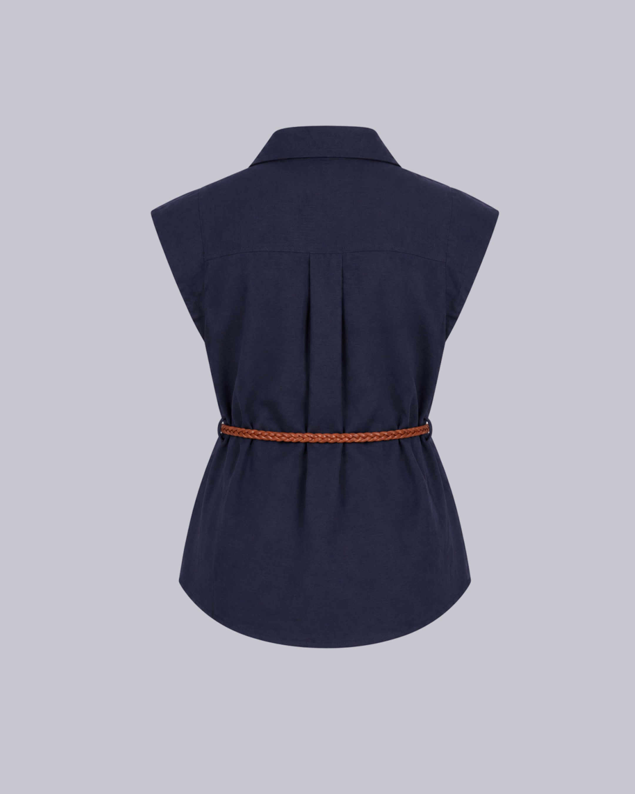 A sleeveless navy blue shirt jacket.