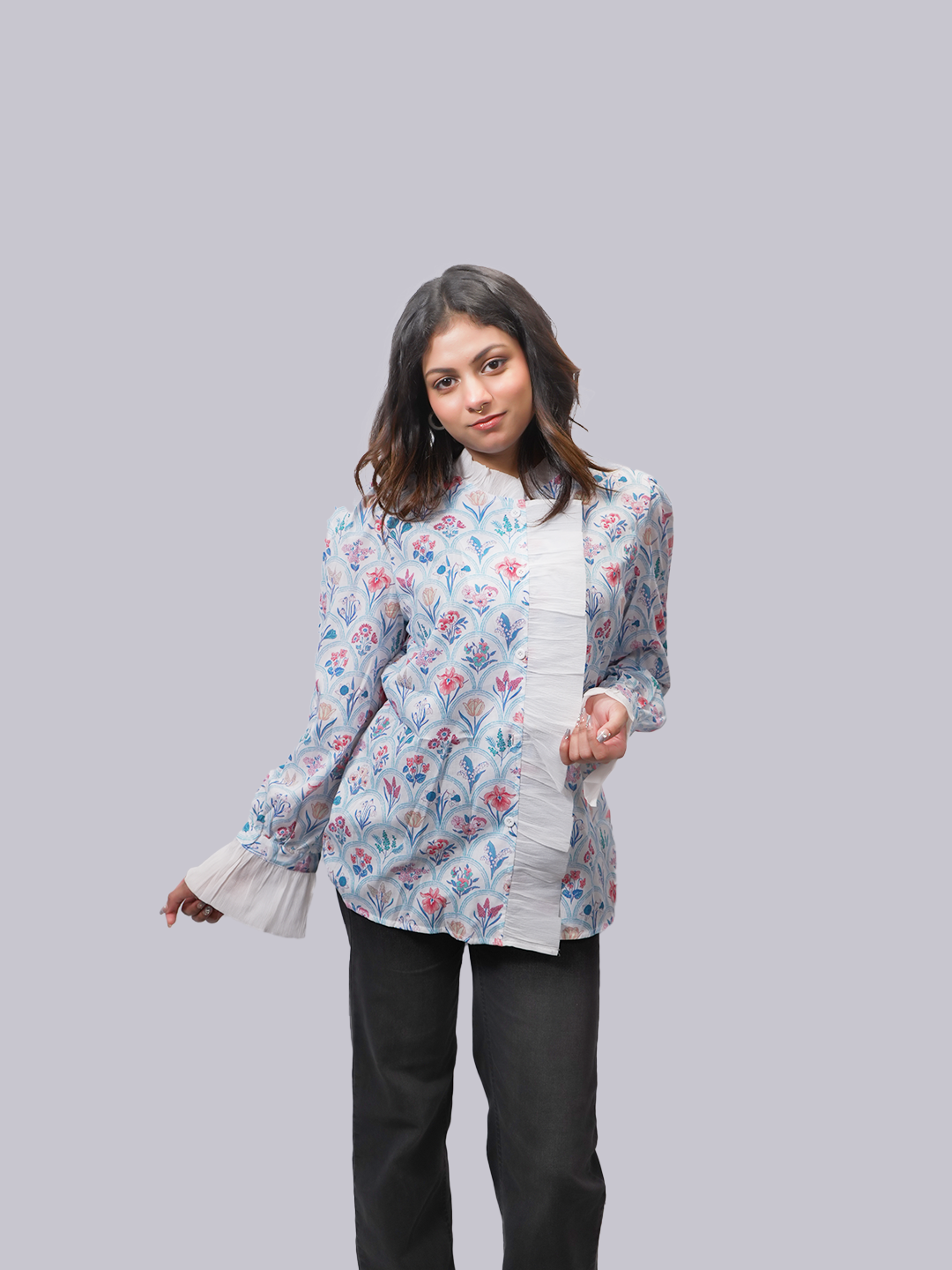 A woman modeling a light blue long-sleeve kurta.