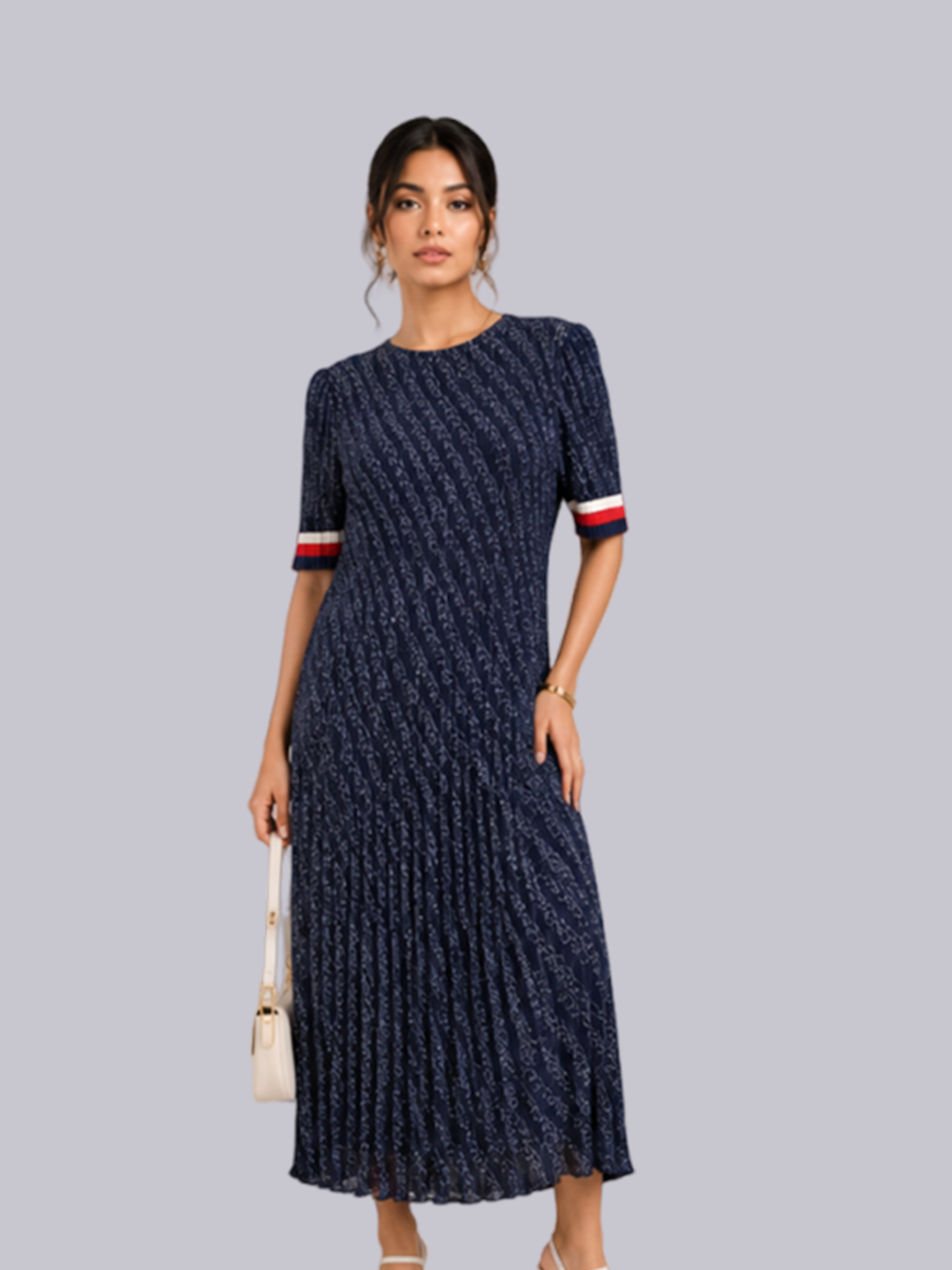 A woman modeling a navy blue pleated midi dress with a textured vertical stripe pattern and short sleeves .