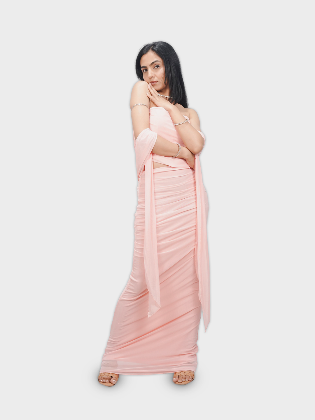 Woman wearing a light pink saree