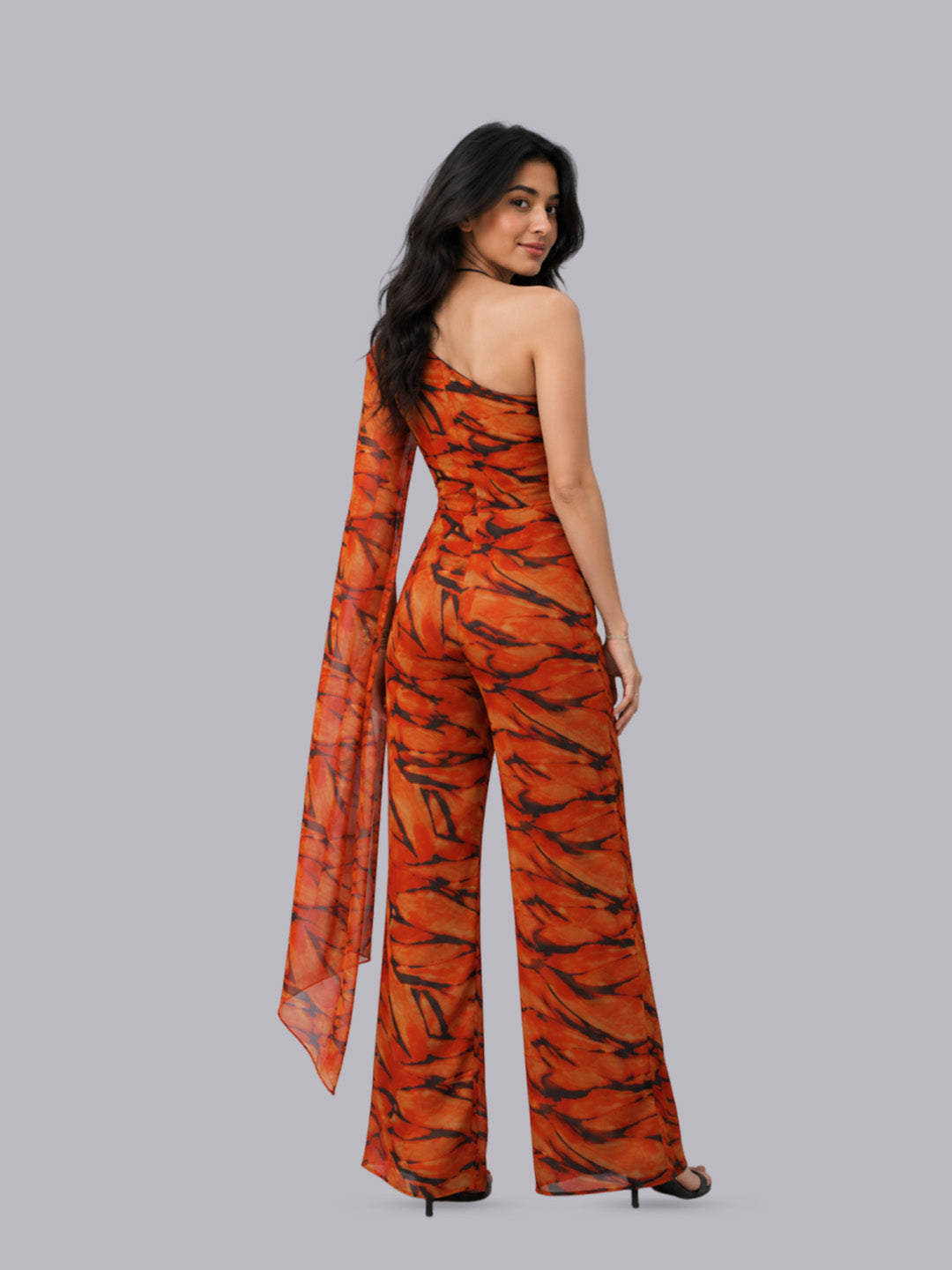 A one-shoulder orange jumpsuit.