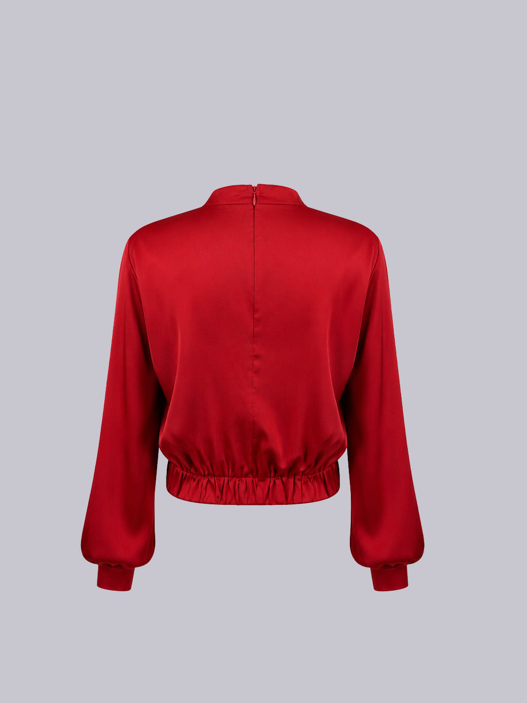 A red satin long-sleeve cropped jacket.