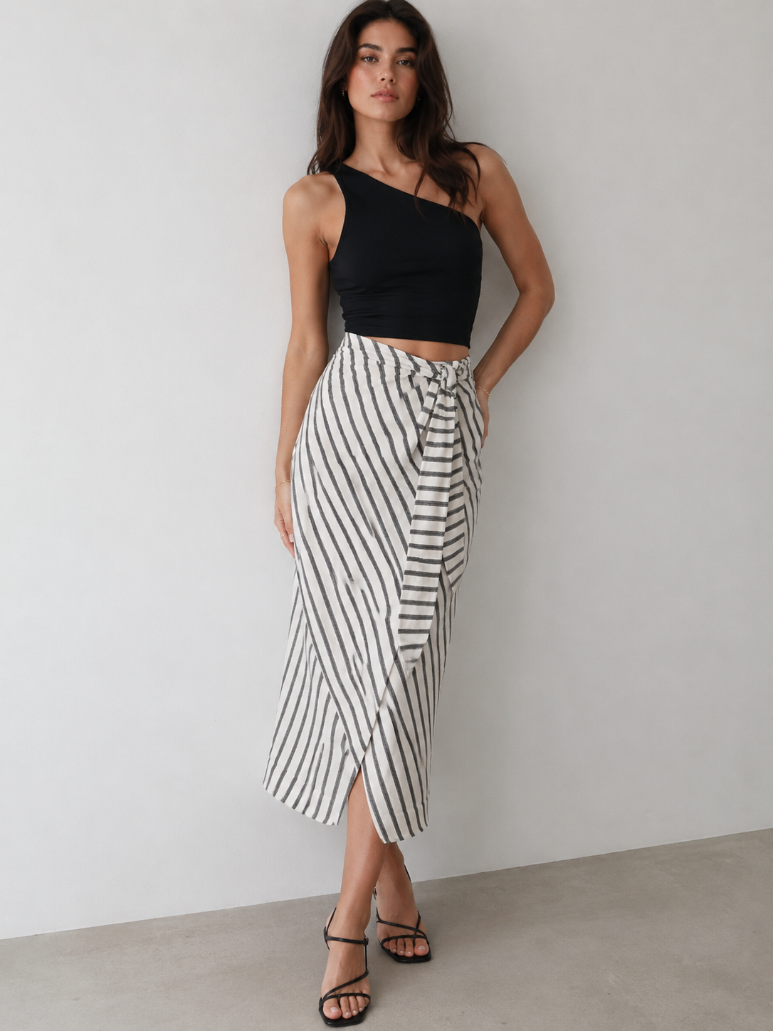 A black one-shoulder crop top
