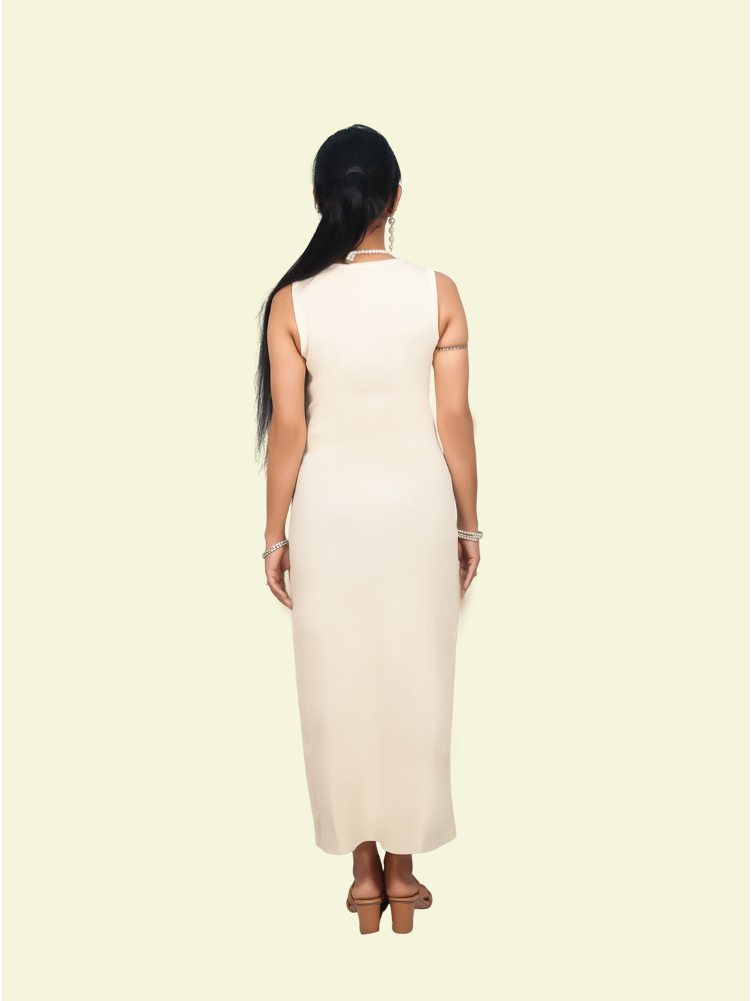 Woman wearing a white sleeveless dress