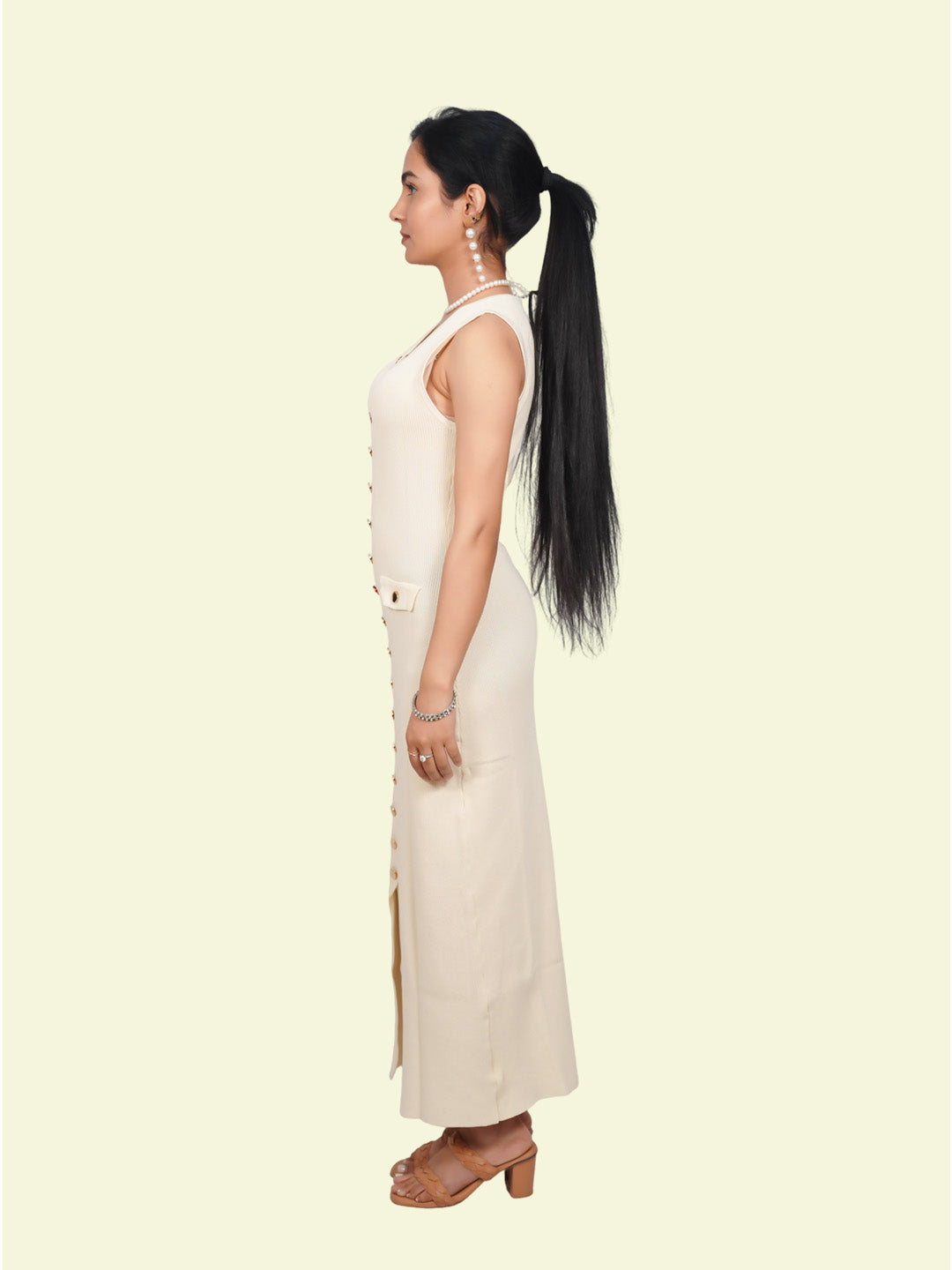 Woman wearing a white sleeveless top .