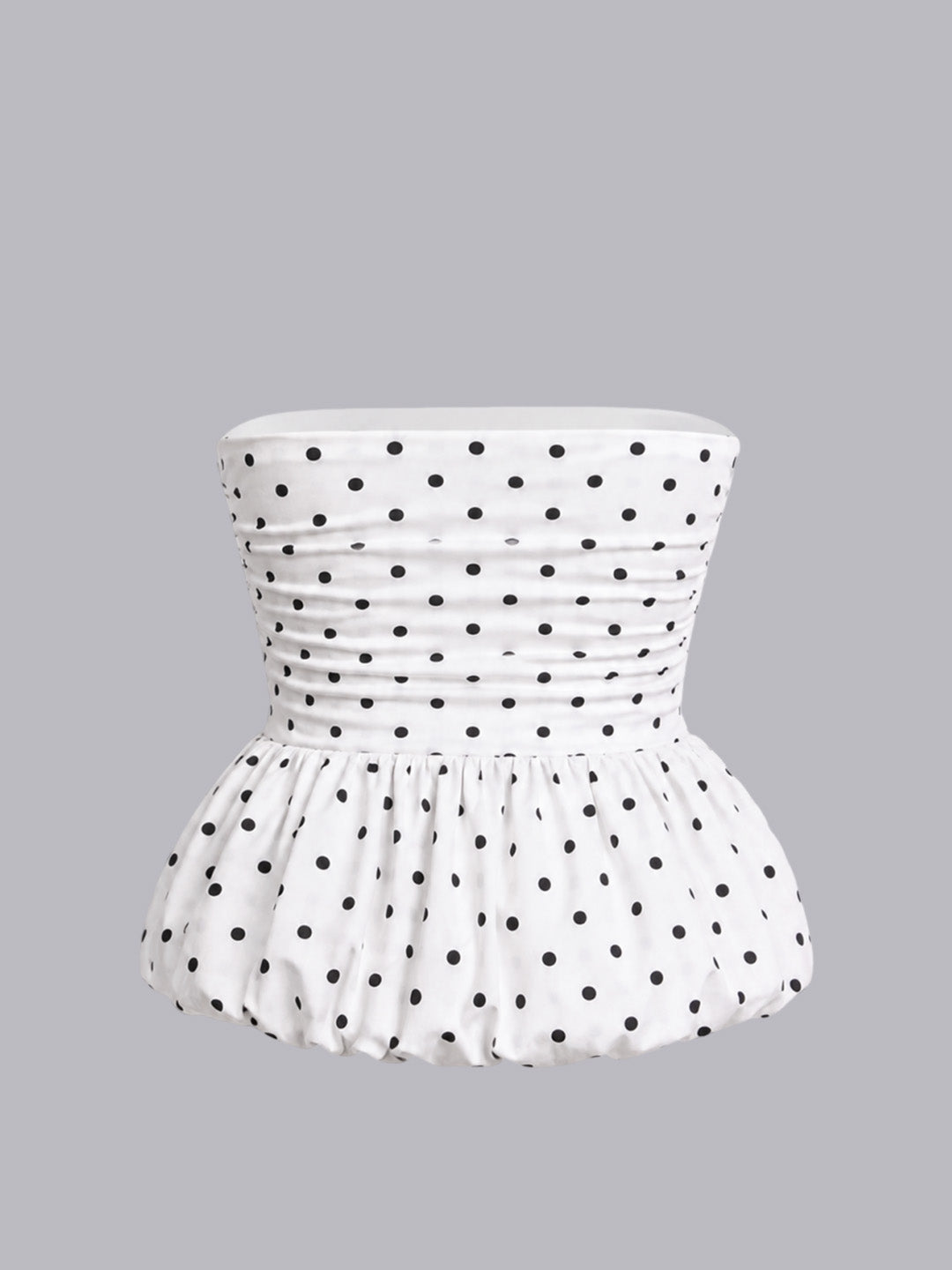 A white strapless top with black polka dots.